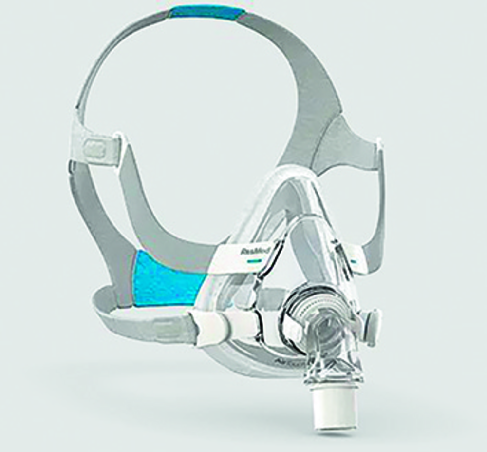 Photographie d'un masque facial de ventilation non invasive avec son harnais